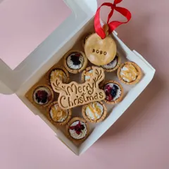 This is my Christmas Tarts Box, filled with blueberry-cranberry and peanut butter tarts. It also comes with a 'Merry Christmas' biscuit and a personalized name tag ornament.
