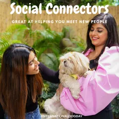 This shot from International Dog Day shows a handy pet sling in action. By capturing two friends interacting with the dog, the photo demonstrates the product's use in a social, real-world context, helping customers imagine using it themselves.