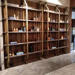 This antique bronze library unit, designed by LTDF for us, showcases a different configuration. The floor-to-ceiling design provides extensive storage while maintaining a sense of lightness and elegance.