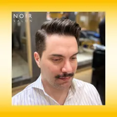 The classic pompadour is timeless for a reason. This style requires precision in both the fade and the styling on top to create that signature volume and clean side part. It’s a sophisticated look for any modern gentleman.