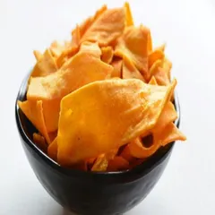 This is a bowl of my baked ragi chips, a fantastic source of calcium and fiber. They have a unique, earthy flavor and are perfect for health-conscious snackers.