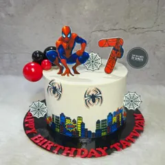 Your friendly neighborhood Spider-Man swings into the party on this custom birthday cake. The design includes an edible city skyline wrap and spiderweb details, perfect for a young superhero fan's 7th birthday.