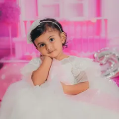 A sweet, thoughtful pose from our little Barbie. Close-up shots like this capture the innocent and curious nature of a two-year-old.