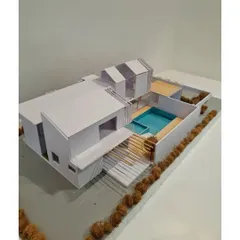 An architectural model for a farmhouse project in Kanakapura. Models like this help us and our clients visualize the spaces, including the A-line roof, central courtyard, and swimming pool.