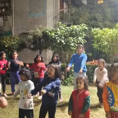 A group of young warriors learning stances during an evening class. Consistent practice helps them build discipline and physical control from an early age.
