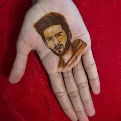 My portrait work extends to modern figures, like this henna portrait of Bollywood actor Kartik Aaryan. This demonstrates the precision and shading techniques I teach in my advanced figure work classes.