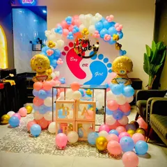 Is it a boy or a girl? I create fun and exciting gender reveal party decorations like this one. This setup includes a custom backdrop, "Boy or Girl" signage, and perfectly coordinated pink and blue balloons with cute foil baby balloons.