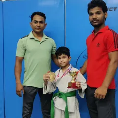 A close up on victory. Young Sreyansh stands proud with his gold medal and trophy, a symbol of his individual triumph and the high standard of our karate coaching.