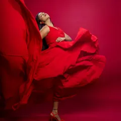 Capturing pure motion and emotion in the studio. The flowing red dress creates a beautiful, dynamic shape, making this a perfect shot for a brand that wants to convey energy and passion.