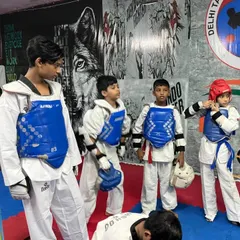 My young students getting ready for a sparring session. They learn to be brave and face challenges head-on.