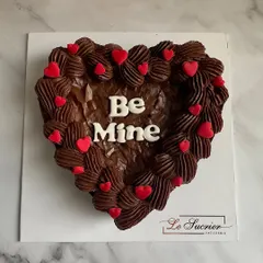 Your perfect Valentine's gift is just an order away. This heart-shaped Belgian chocolate brownie is topped with rich chocolate ganache and a "Be Mine" message.