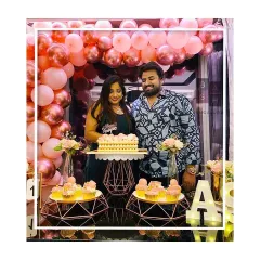 Here is another beautiful moment from the anniversary celebration, showing the couple ready to cut their custom cake. We coordinate every element, from the balloon colors to the dessert stands, to create a harmonious and elegant look.