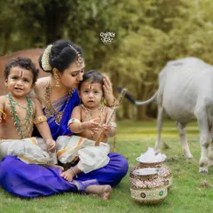 A mother's love for her two little Krishnas, captured in a beautiful outdoor setting. I love creating these special Janmashtami portraits for families with twins.