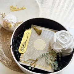 A luxurious velvet gift box curated for Eid. It contains a mini Quran, Tasbeeh, a rolled scarf, and earrings, making it a perfect Eidi for a loved one.