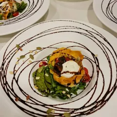 A beautifully plated vegetarian main course with a dramatic balsamic swirl. For our sit-down dinners, we believe the presentation should be as impressive as the taste.