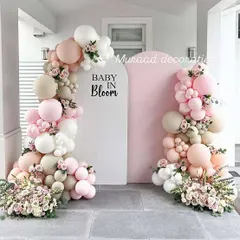 For a soft and elegant baby shower, the 'Baby in Bloom' theme is a beautiful choice. I combine blush, white, and cream balloons with delicate floral arrangements to create a sophisticated and welcoming atmosphere for the mom-to-be.