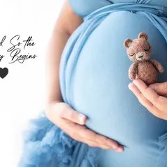 "And So The Journey Begins". This creative close-up on the baby bump with a tiny teddy bear prop is a beautiful and symbolic shot.