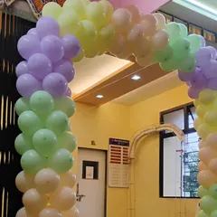 This is another example of a simple and classic pastel balloon arch. It's a versatile design that works well for framing doorways and creating a clear entry point for guests at any type of celebration.