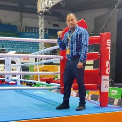 This is me in the boxing ring, where I feel most at home. My career as a coach is built on years of dedication to this sport, and I am committed to developing the next generation of boxers.