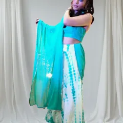 A custom outfit should reflect your personality. This tie-dye skirt and mirror-work halter top was created for a sangeet, designed to be fun, vibrant, and perfect for dancing.
