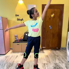 A young student strikes a graceful ballet pose while on roller skates. My artistic skating classes merge the worlds of dance and skating.