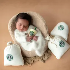 Our little caffeine connoisseur holding his very own tiny Starbucks cup. This was such a fun and personal theme to create for the family.