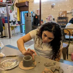 A close-up of a participant hand-building a pot. This technique doesn't use the wheel and is perfect for creating more organic or sculptural shapes.