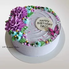 A lovely lavender-hued cake with hand-piped dahlia flowers. This is a beautiful example of how whipped cream can be used to create stunning floral textures.
