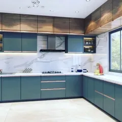 A contemporary kitchen featuring deep teal handleless cabinets paired with rich wood-grain overhead units. The white marble backsplash and countertop brighten the space, while under-cabinet lighting provides excellent task illumination.
