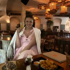 A toast to a wonderful meal at Ophelia, Delhi. This image captures the restaurant's elegant and moody ambiance, perfect for an evening of fine dining.