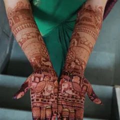 The same design after a few hours. You can see the stain starting to darken, bringing out the intricate details of the elephants and dholki motifs.