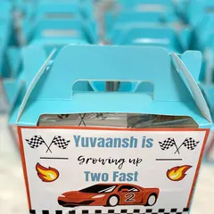 Zooming into a second birthday! These personalized return favour boxes were designed for Yuvaansh's "Two Fast" racing-themed party.