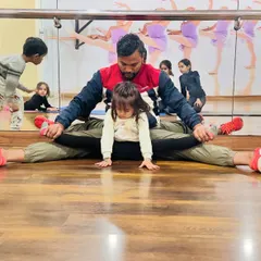 It all starts with flexibility, even for my youngest students. This little gymnast is only three years old and is already learning how to stretch correctly with my help. We make it safe and fun for them.