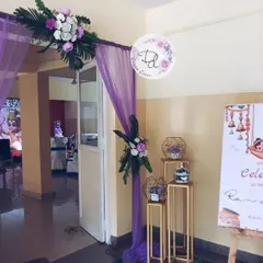 The entrance for the Ram-themed naming ceremony. Purple drapes, floral arrangements, and a custom welcome board set the theme from the very beginning.