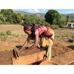 The heart of our process is in the hands of the community. Here, a woman from a village in Madhya Pradesh makes adobe bricks from the local soil. This image captures the essence of participatory design, where local skills and materials are not just used, but celebrated.