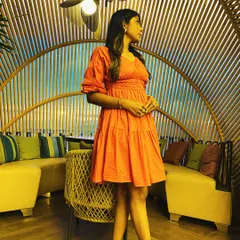 Another angle of the coral dress, showing how it moves. Finding the right silhouette for your body shape is key to feeling confident.