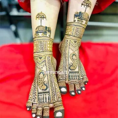 A regal design for the feet, featuring elephants carrying decorative umbrellas (chattar), symbolizing a royal procession.