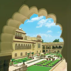 At the Rambagh Palace Hotel, a project from 1973, my approach was to convert a historic palace into a five-star hotel while retaining its original charm. This view through a scalloped arch frames the magnificent courtyard, a key part of the guest experience.