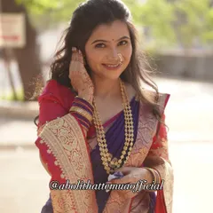 A beautiful shot showcasing the soft curls and half-up hairstyle I created for this engagement look, perfectly complementing the traditional attire.
