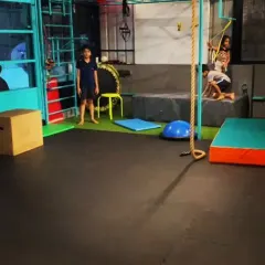 A wide view of our training space in Jaynagar. You can see the padded floors, climbing ropes, and other equipment we use to create a versatile and safe training ground for kids.