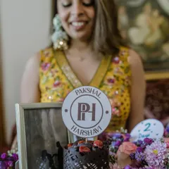A personalized cake topper and a framed photo are among the little things that pack the most meaning. We believe in weaving these thoughtful, surprising touches throughout the celebration.