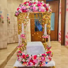 This is one of my most popular Doli rentals, decorated with a full arch of pink and white flowers and hanging floral tassels. It's perfect for a fairytale bridal entry.