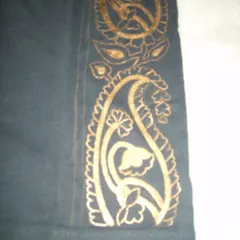 A detailed shot of the hand-painted paisley design. You can see the intricate floral patterns within the motif, all done with fabric paint to ensure it is washable and durable.