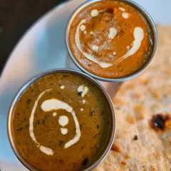 A classic combination for any North Indian food lover: our creamy Dal Makhani and rich Paneer Butter Masala, served with hot butter phulkas. This is comfort food at its best.
