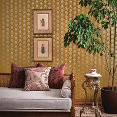 This setting demonstrates a more subdued but equally elegant Sabyasachi design, with a patterned wallpaper that complements a classic daybed. It shows the versatility of the collection.