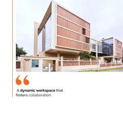 The facade of the Mahindra Chakan office, a dynamic workspace that fosters collaboration. The design features a sun-responsive facade that adapts to natural light, blurring the line between indoor and outdoor spaces.