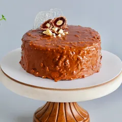 This is my bestseller for a reason. The Almond Rocher Cake has layers of rich chocolate sponge and Nutella, all wrapped in a crunchy almond chocolate glaze. It’s an experience of textures, from the hard outer shell to the dreamy, soft inside.