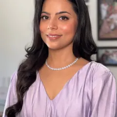 A final portrait in indoor lighting, showing how the makeup photographs beautifully. The skin looks smooth, hydrated, and luminous.