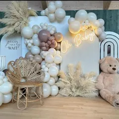 A close-up of the boho teddy bear baby shower decor, highlighting the mix of balloon sizes and the "We Can Bearly Wait" signage. This theme is perfect for a gender-neutral or modern baby celebration.