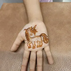 A close-up of the unicorn design. I can create any character or motif that your child loves to make their mehndi experience magical.